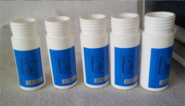 labelled samples by semi automatic round bottle labeling mac