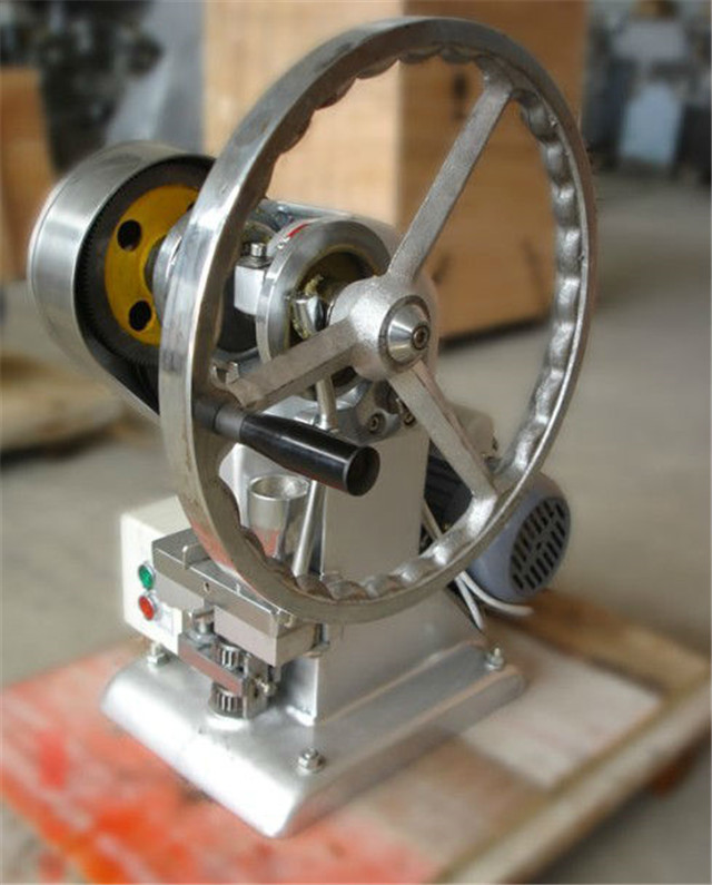 side view of single-punch tablet press.jpg