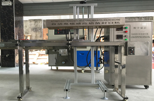 full view of automatic induction aluminum foil sealing machi