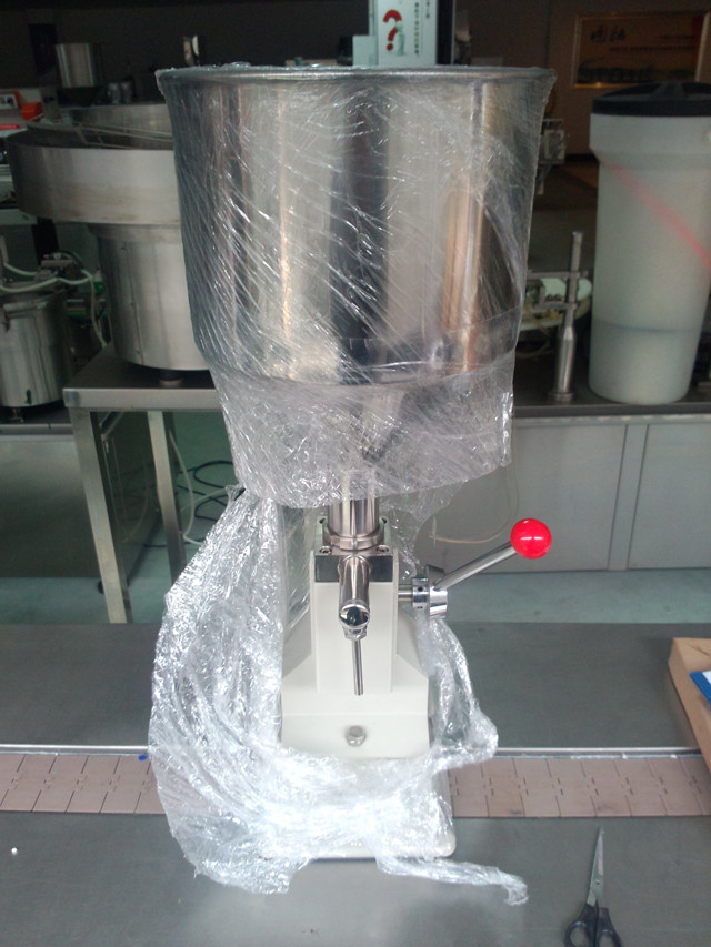 front view of hand operated lotion liquid filling machine.jp