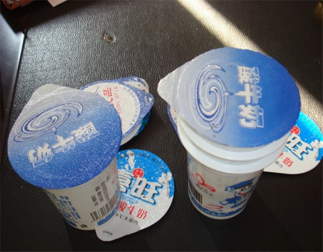 filled cups by  rotary plastic paper cup filling sealing mac