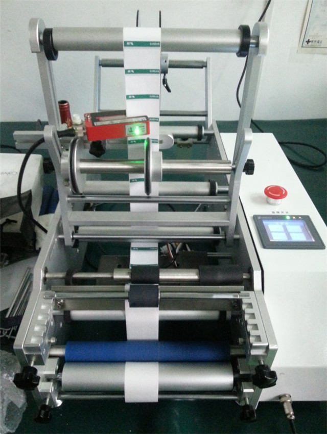 front view of semi automatic syringe labeler.jpg