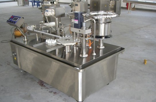 whole view of YX perfume filling plugging capping  machine.j