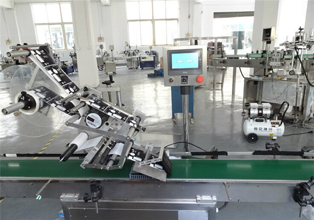 flat surface top labeling machine automatic at workshop.jpg